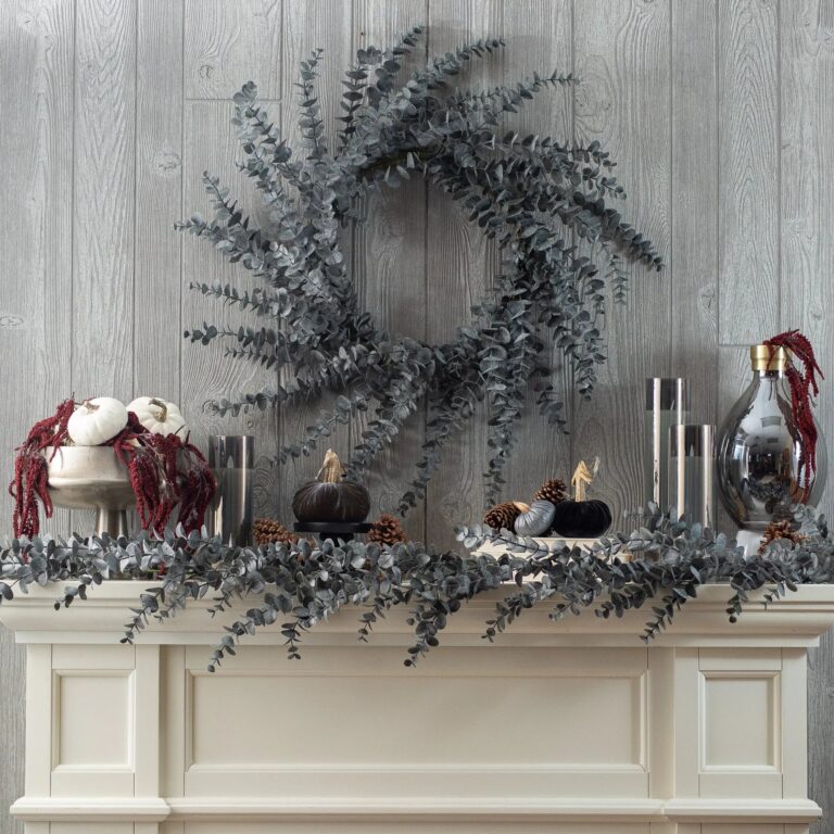 Close-up of greenery along the garland on this Midnight Eucalyptus Fall Halloween Table Runner Mantel