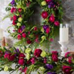 Close-up of greenery along the garland on this Mixed Magenta, Purple and Green Runner Mantle