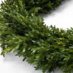 Close-up of greenery along the garland on this Green Boxwood Artificial All Seasons Greenery Mantel