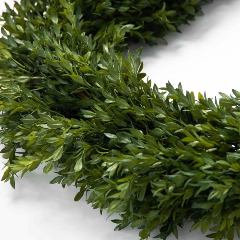 Close-up of greenery along the garland on this Green Boxwood Artificial All Seasons Greenery Mantel
