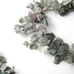 Close-up of greenery along the garland on this Candlelit Evenings - Faux Dusty Christmas Mantel