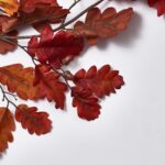 Close-up of greenery along the garland on this Burgundy Red Autumn Oak Leaf Runner Mantel
