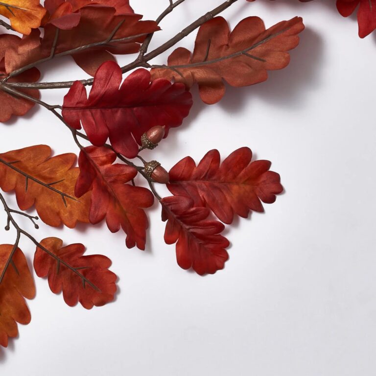 Close-up of greenery along the garland on this Burgundy Red Autumn Oak Leaf Runner Mantel