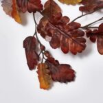 Close-up of greenery along the garland on this Rustic Brown Oak Leaf Runner Mantle Garland