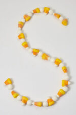 Alternate angle of the Sugar Frosted Faux Candy Corn Corn Fall Garland showing full length