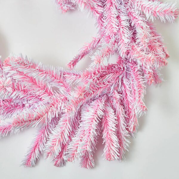 Close-up of greenery along the garland on this Deluxe Pink and White Candy Mantel Stairway