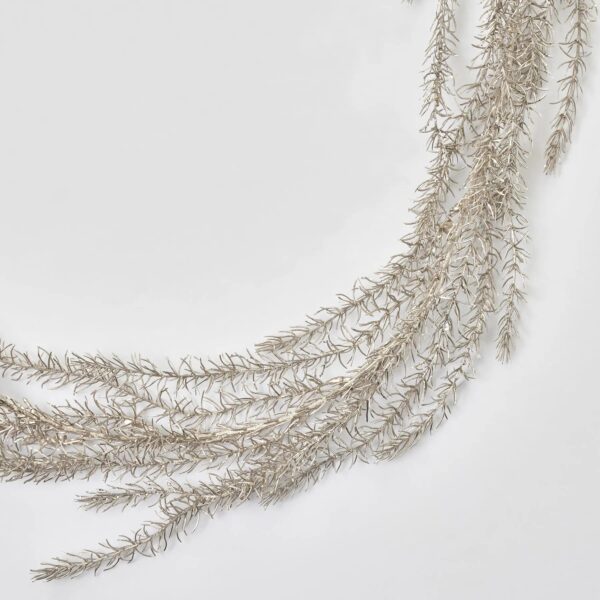 Close-up of greenery along the garland on this Shimmering Metallic Champagne Gold Glitter Pine Holiday