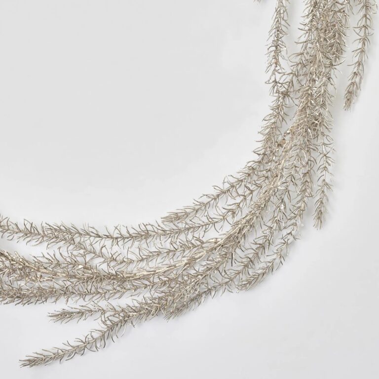 Close-up of greenery along the garland on this Shimmering Metallic Champagne Gold Glitter Pine Holiday