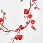 Close-up of greenery along the garland on this Red Glitter Heart Garland Valentine's Glitter Heart