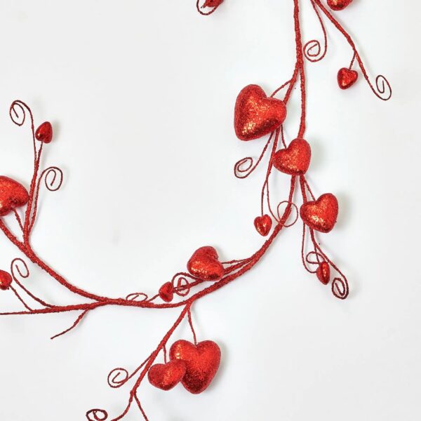Close-up of greenery along the garland on this Red Glitter Heart Garland Valentine's Glitter Heart