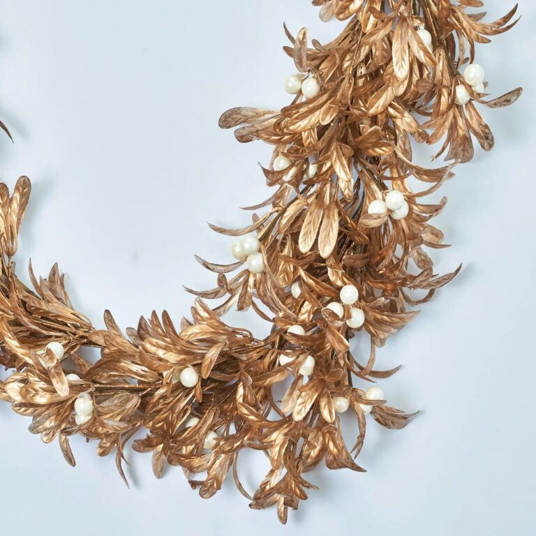 Close-up of greenery along the garland on this Shiny Metallic Gold Boxwood Christmas Mantle Garland