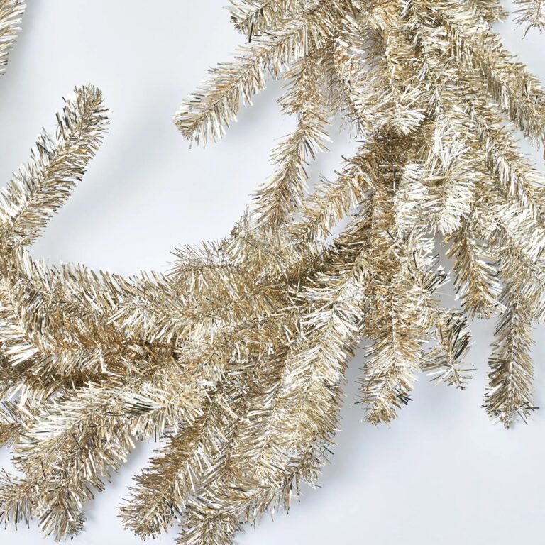 Close-up of greenery along the garland on this Silver and Gold Metallic Soft Tinsel Christmas