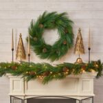 Close-up of greenery along the garland on this Pre - Lit Long Needle Pinecone Christmas