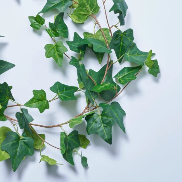 Close-up of greenery along the garland on this All Seasons Faux English Ivy Leaf Mantel