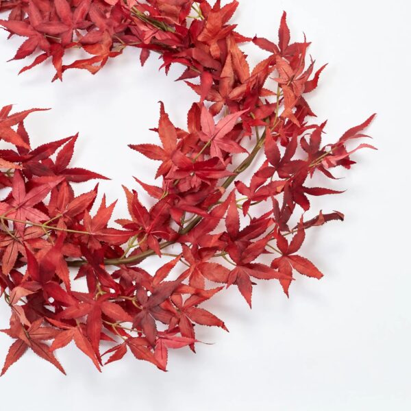 Close-up of greenery along the garland on this Red Japanese Maple Leaf Mantel Leaf Mantel