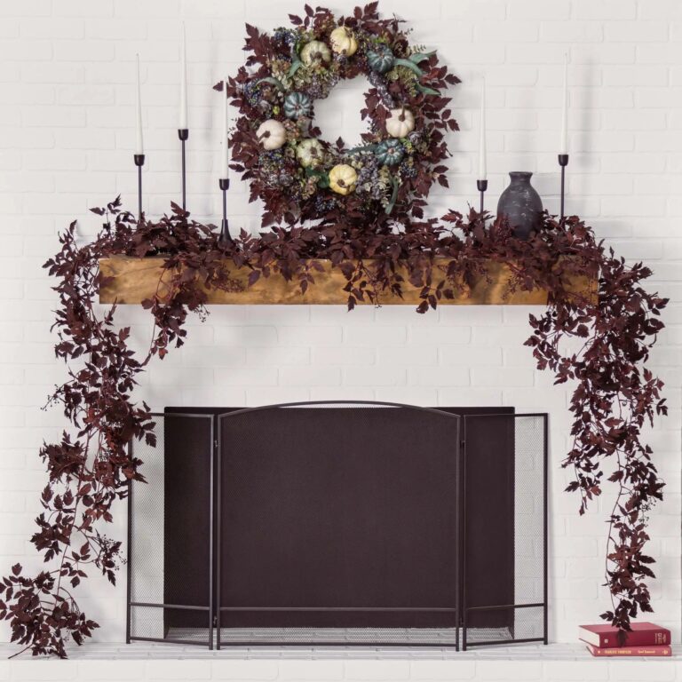 Close-up of greenery along the garland on this Dark Plum Cimicifuga Ramosa Leaf Berry Mantel