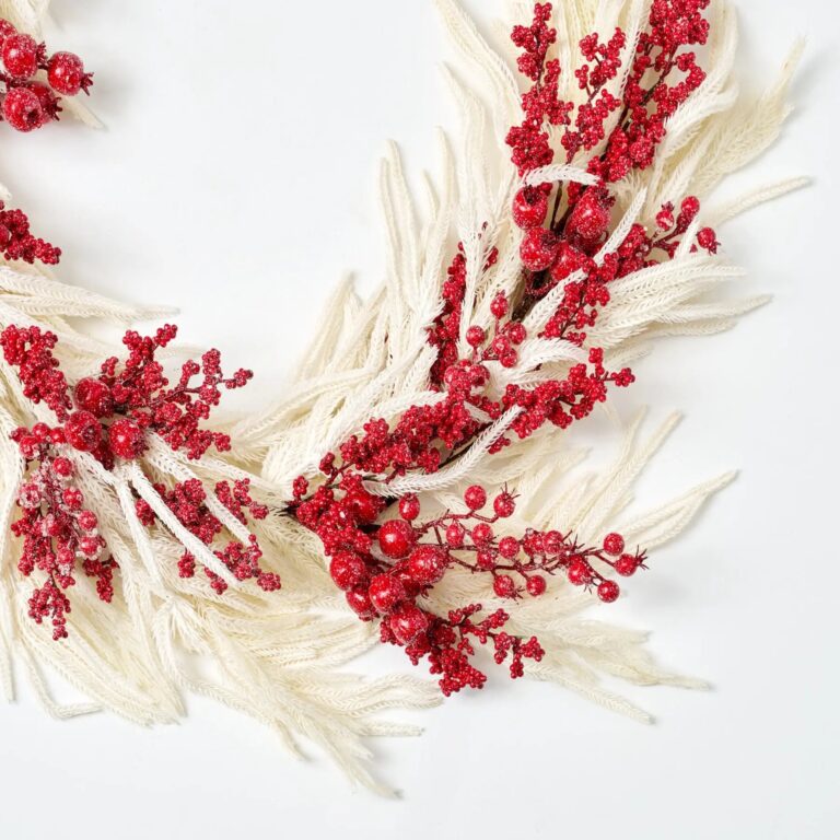 Close-up of greenery along the garland on this Iced Red Berry and Real Pine Mantle