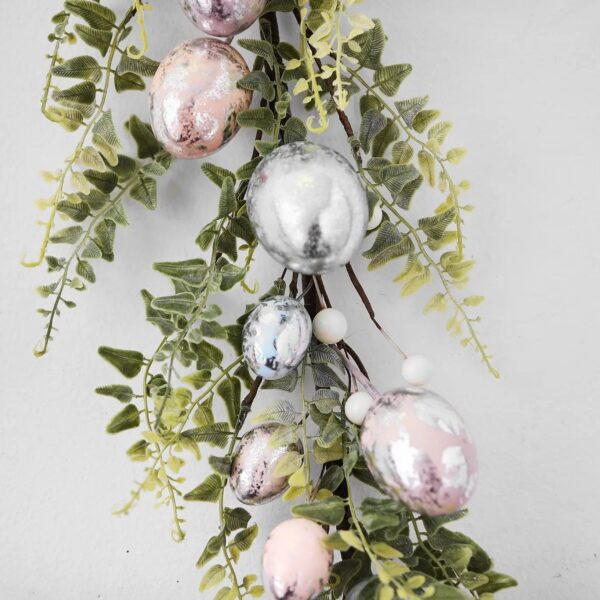 Close-up of greenery along the garland on this Pink, Blue and Silver Metallic Easter Egg
