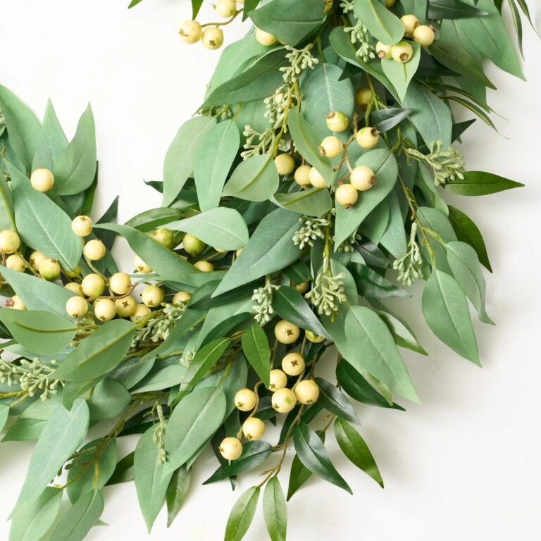 Close-up of greenery along the garland on this All Seasons Faux Blade Eucalyptus, Gooseberries Mantle