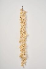 Close-up of greenery along the garland on this Harvest Shimmer - Bleached Oak Fall Mantle