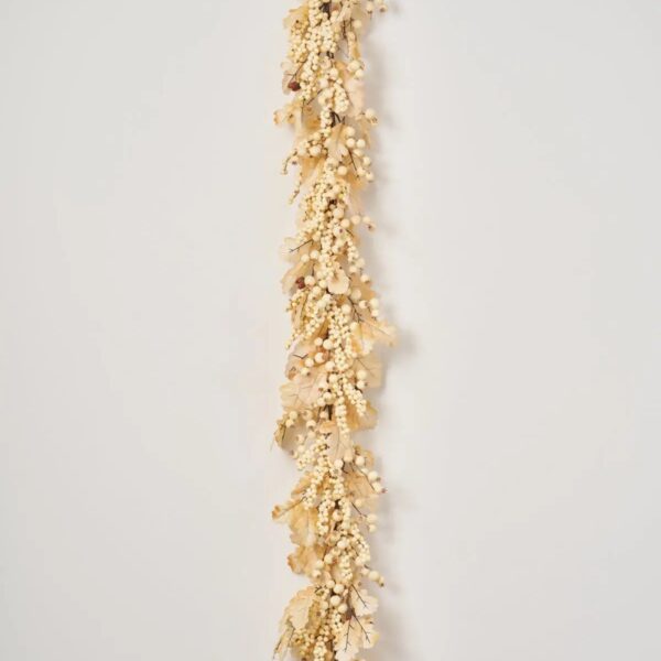 Close-up of greenery along the garland on this Harvest Shimmer - Bleached Oak Fall Mantle