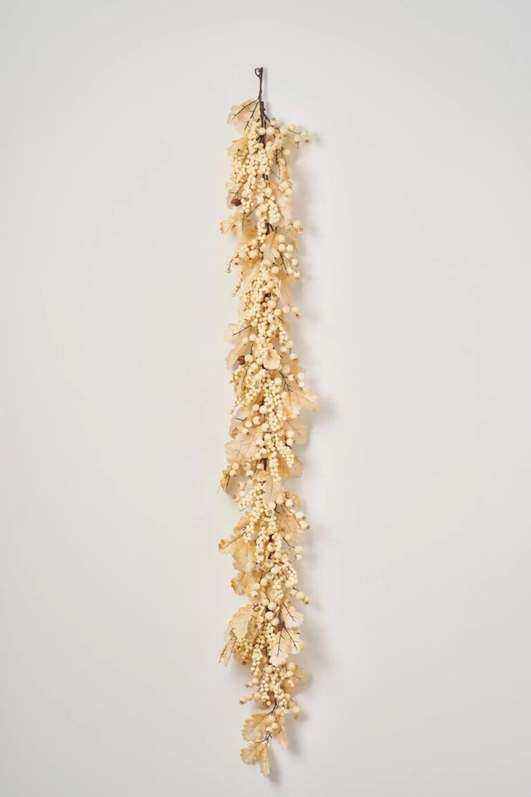 Close-up of greenery along the garland on this Harvest Shimmer - Bleached Oak Fall Mantle