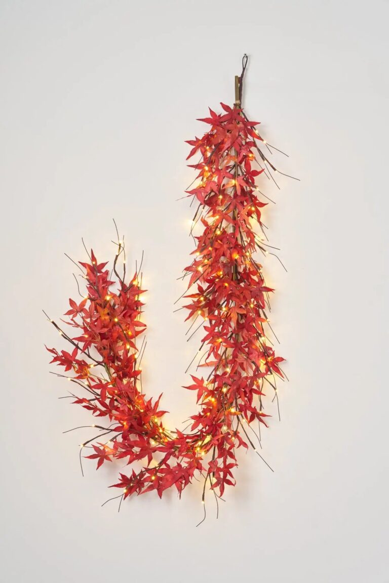Close-up of greenery along the garland on this Brown Branch and Twig Lighted lit Garland
