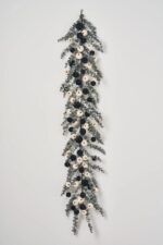Close-up of greenery along the garland on this Dark Enchantment - Dark Grey Fall Mantle