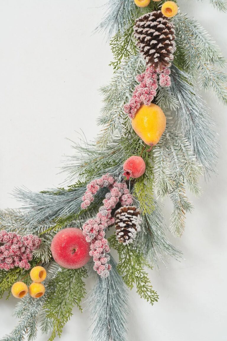 Close-up of greenery along the garland on this Frosted Fruit - Sugared Apple, Mantle Holiday
