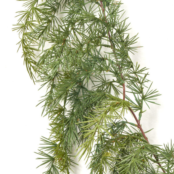 Close-up of greenery along the garland on this Draping Green Pine Garland Cascading Green Pine