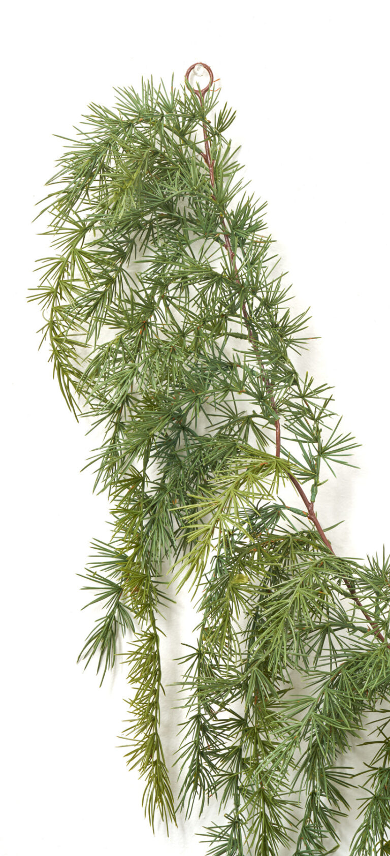 Close-up of greenery along the garland on this Draping Green Pine Garland Cascading Green Pine