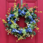 Detail view of layered greenery detail from the Green Hydrangea, Forsythia, Blue Cosmos Berry Spring