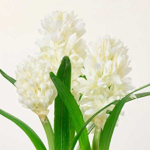Close-up of leaf foliage texture on this White Hyacinth Bulbs Artificial Indoor Houseplant in Blue