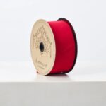 Close-up of blooms and berries on this D. Stevens Christmas Red Taffeta Lined Ribbon Spool