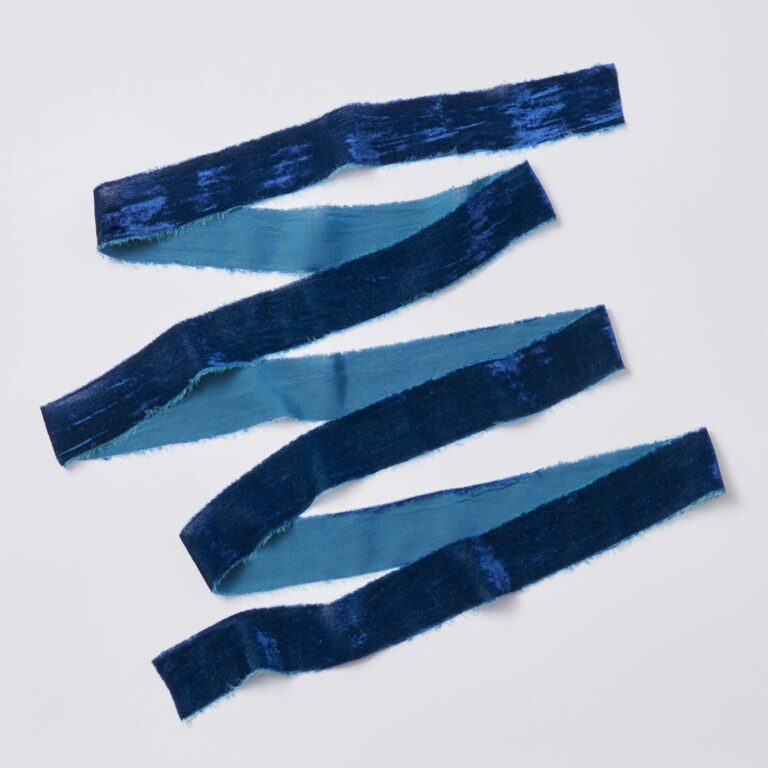 Close-up of blooms and berries on this Blue Raw Edge Frayed Velvet Frayed Velvet Ribbon
