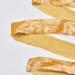 Alternate angle of the Golden Mustard Raw Edge Frayed Frayed Velvet Ribbon showing wreath face