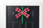 Close-up of blooms and berries on this Red, White and Green Matte Door Swag Wreath