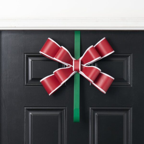 Close-up of blooms and berries on this Red, White and Green Matte Door Swag Wreath