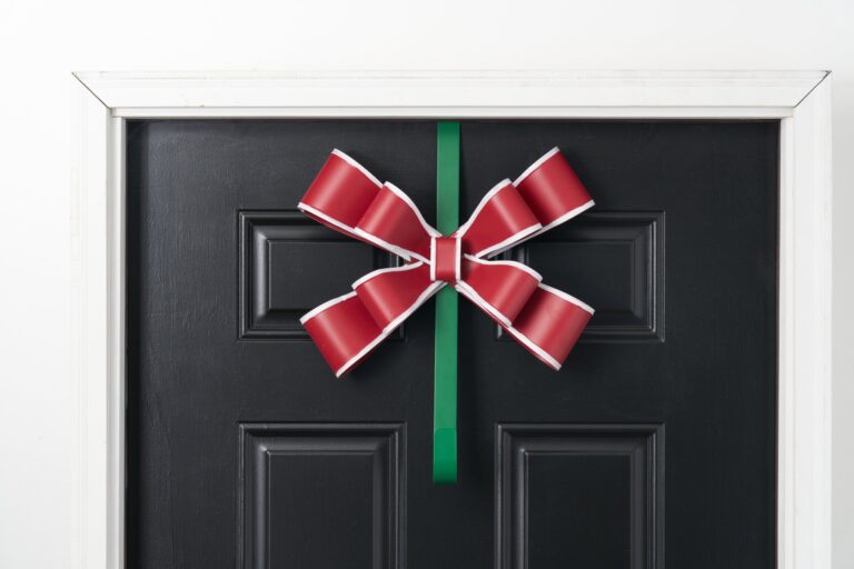Close-up of blooms and berries on this Red, White and Green Matte Door Swag Wreath