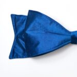 Close-up of blooms and berries on this Large Lux Midnight Blue Velvet Christmas Tree Bow