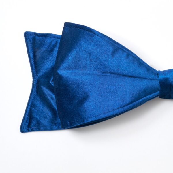 Close-up of blooms and berries on this Large Lux Midnight Blue Velvet Christmas Tree Bow