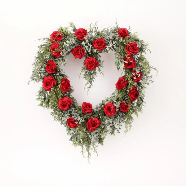Close-up of blooms and berries on this Winter's Romance Red Rose, Juniper, Heart Valentine Wreath