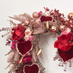 Close-up of blooms and berries on this Whatever Lola Wants - Luxury Heart Shaped Wreath