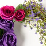 Close-up of blooms and berries on this Purple and Magenta Ombre Rose Valentine's Day Wreath
