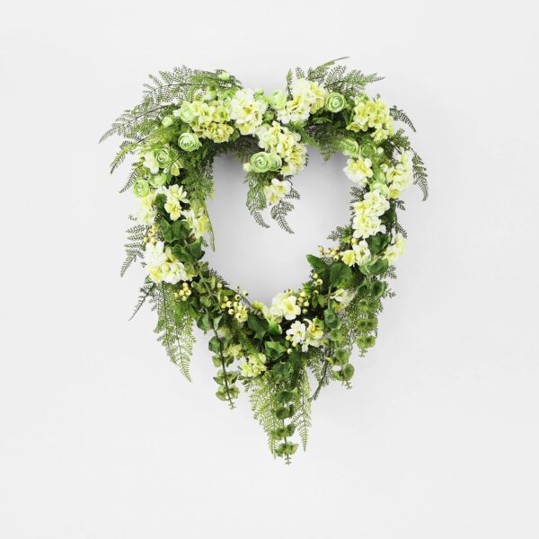 Close-up of blooms and berries on this Lucky In Love - Bells Day Heart Wreath