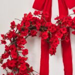 Close-up of blooms and berries on this Luxe in Love - Red Bow Hanger