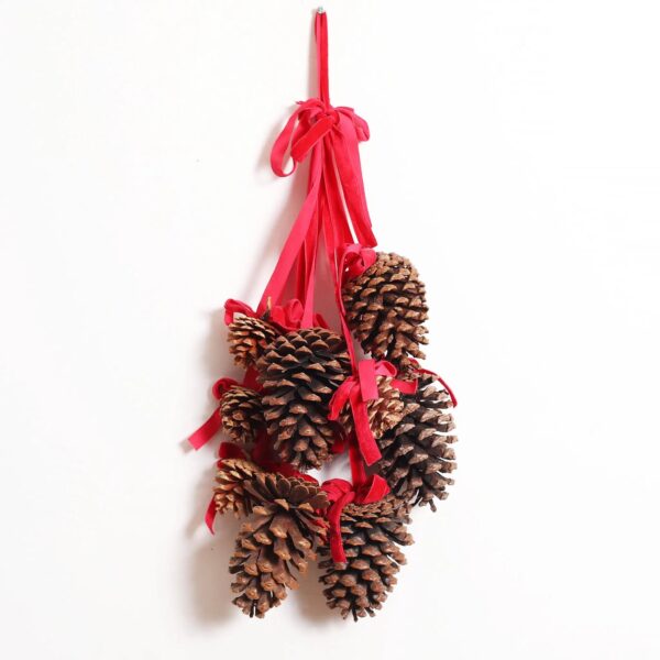 Close-up of swag tail detail on this Multi Pinecone Christmas Hanging Decor Red Velvet Ribbon