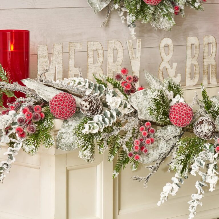Close-up of greenery along the garland on this Holiday Frost - Snow Magnolia, Mantle Christmas