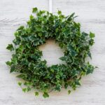 Close-up of blooms and berries on this Green Variegated Real Touch English Front Door Wreath
