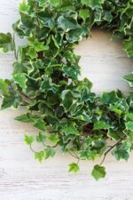 Alternate angle of the Green Variegated Real Touch English Front Door Wreath showing wreath face